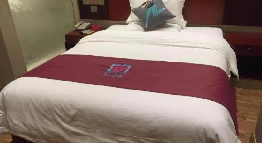 Bed in PAI Hotel Guangzhou North Gate of Chimelong Zoo