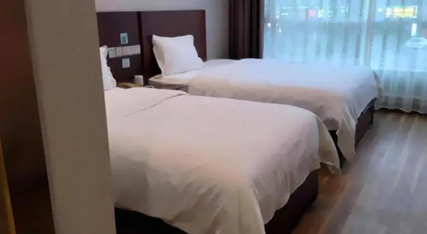 Bed in PAI Hotel Guangzhou North Gate of Chimelong Zoo