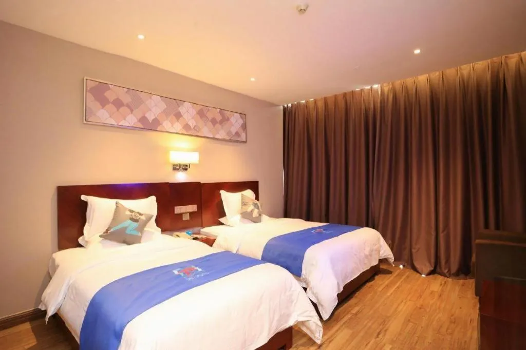 Bed in PAI Hotel Guangzhou North Gate of Chimelong Zoo