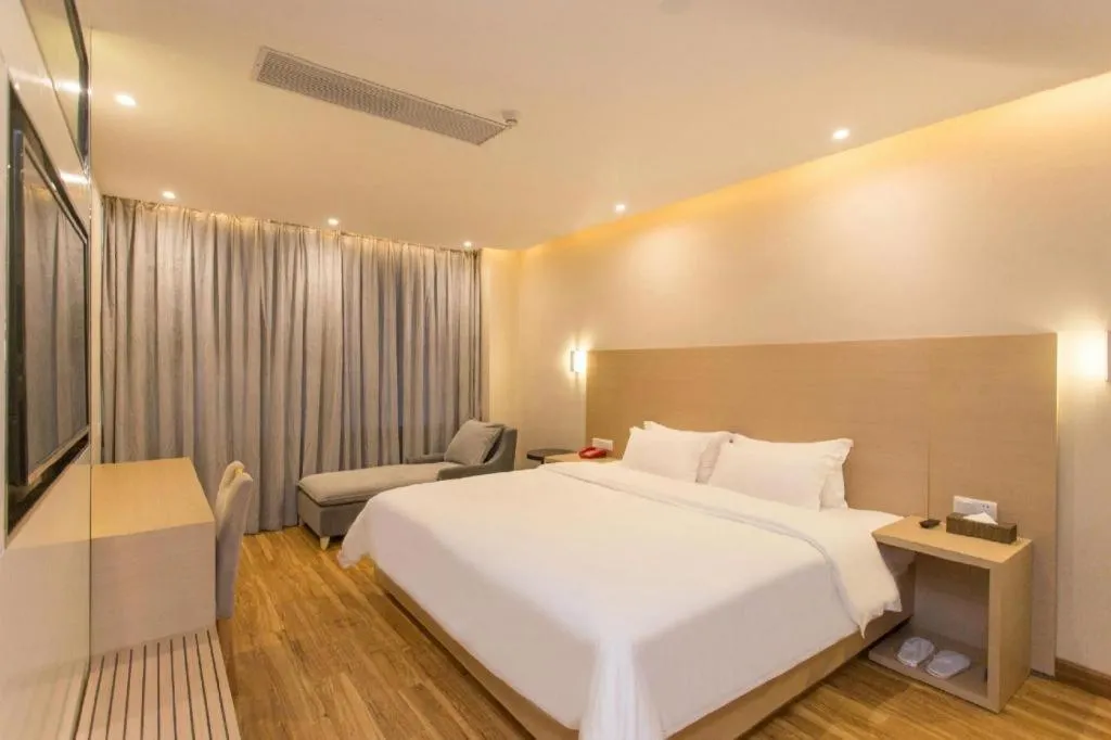 Bed in PAI Hotel Guangzhou North Gate of Chimelong Zoo