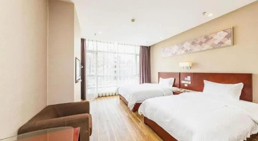 Bed in PAI Hotel Guangzhou North Gate of Chimelong Zoo Bed in PAI Hotel Guangzhou North Gate of Chimelong Zoo