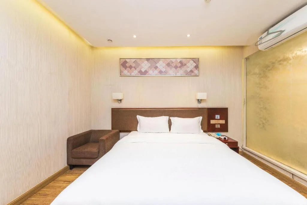 Bed in PAI Hotel Guangzhou North Gate of Chimelong Zoo