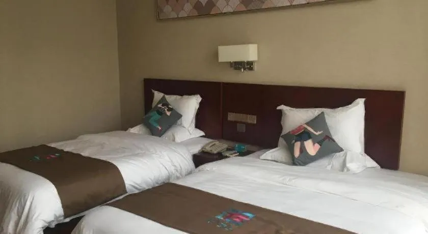 Bed in PAI Hotel Guangzhou North Gate of Chimelong Zoo