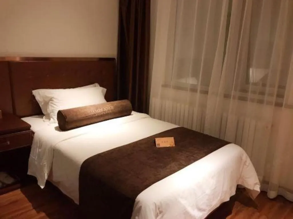 Bed in James Joyce Coffetel Beijing Qianmen Branch