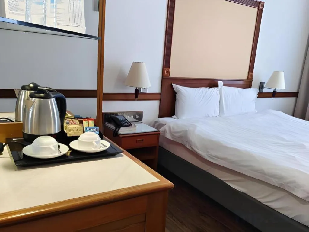 Bed in Grand City Hotel