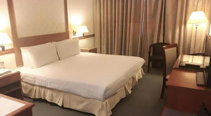 Bed in Grand City Hotel