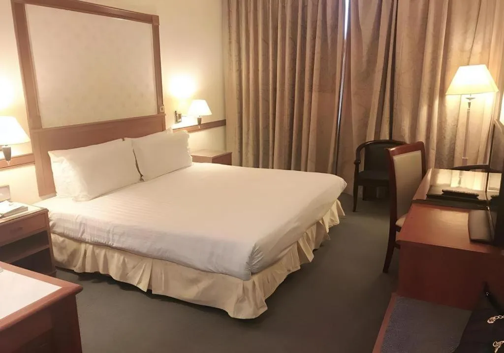 Bed in Grand City Hotel