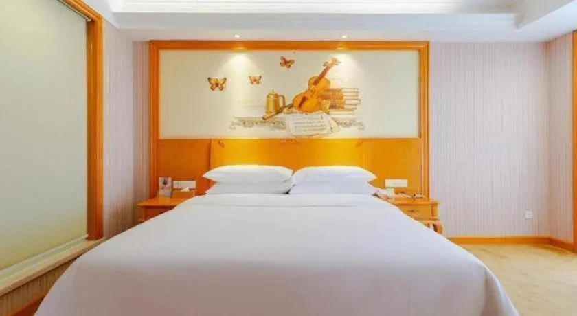 Bed in Vienna International Hotel Kunming Guangfu Road Aegean Shopping Center