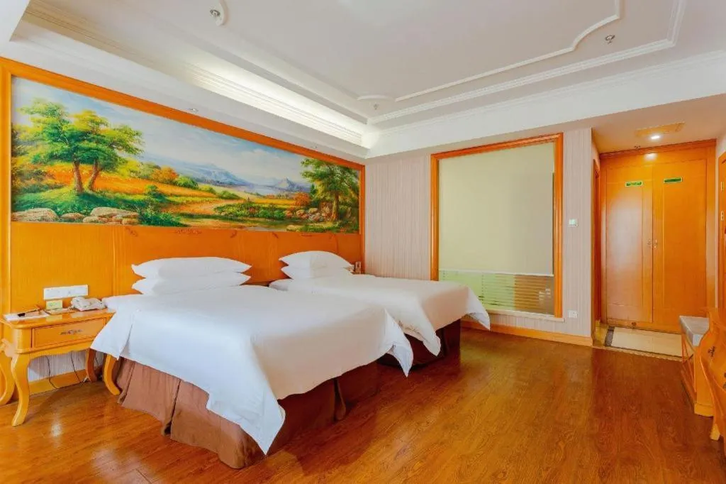 Bed in Vienna International Hotel Kunming Guangfu Road Aegean Shopping Center