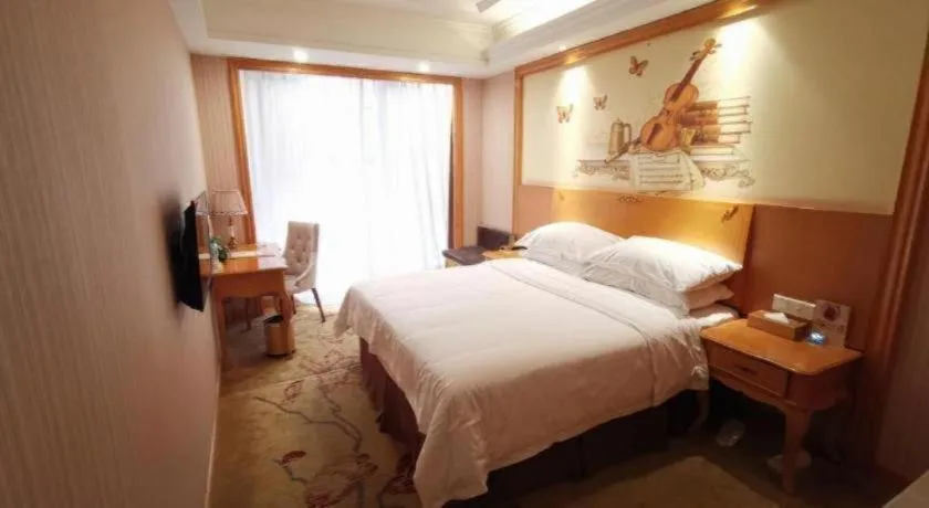 Bed in Vienna International Hotel Kunming Guangfu Road Aegean Shopping Center