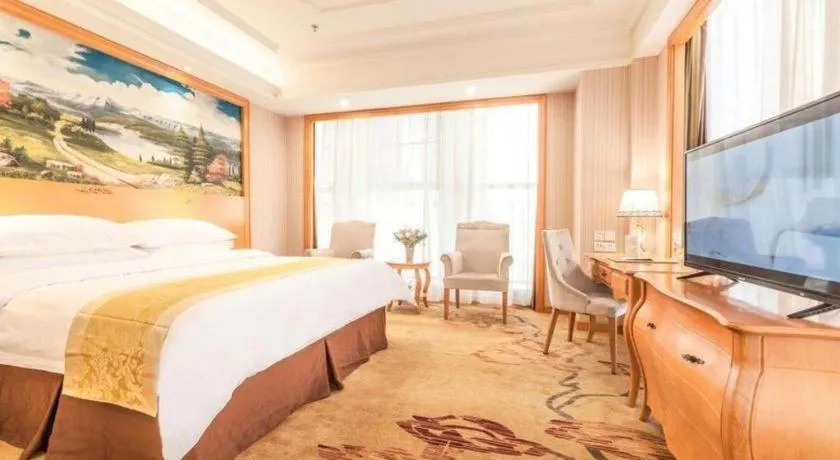 Bed in Vienna International Hotel Kunming Guangfu Road Aegean Shopping Center