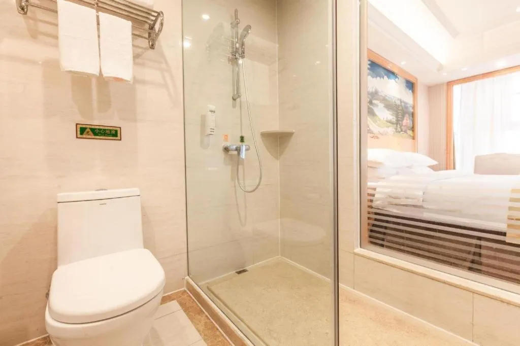 Bed in Vienna International Hotel Kunming Guangfu Road Aegean Shopping Center