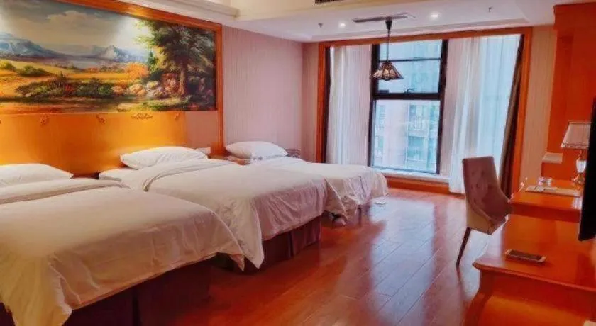 Bed in Vienna International Hotel Kunming Guangfu Road Aegean Shopping Center