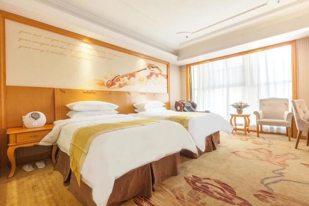 Bed in Vienna International Hotel Kunming Guangfu Road Aegean Shopping Center