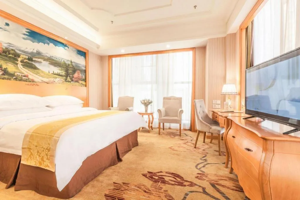 Bed in Vienna International Hotel Kunming Guangfu Road Aegean Shopping Center