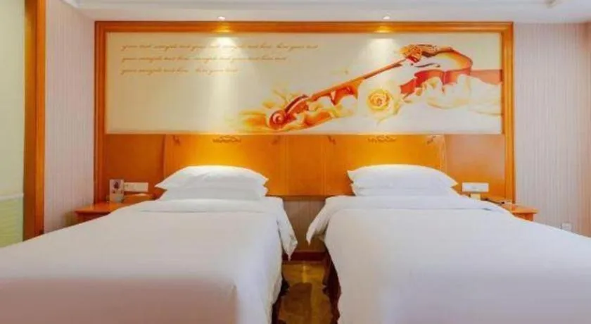 Bed in Vienna International Hotel Kunming Guangfu Road Aegean Shopping Center