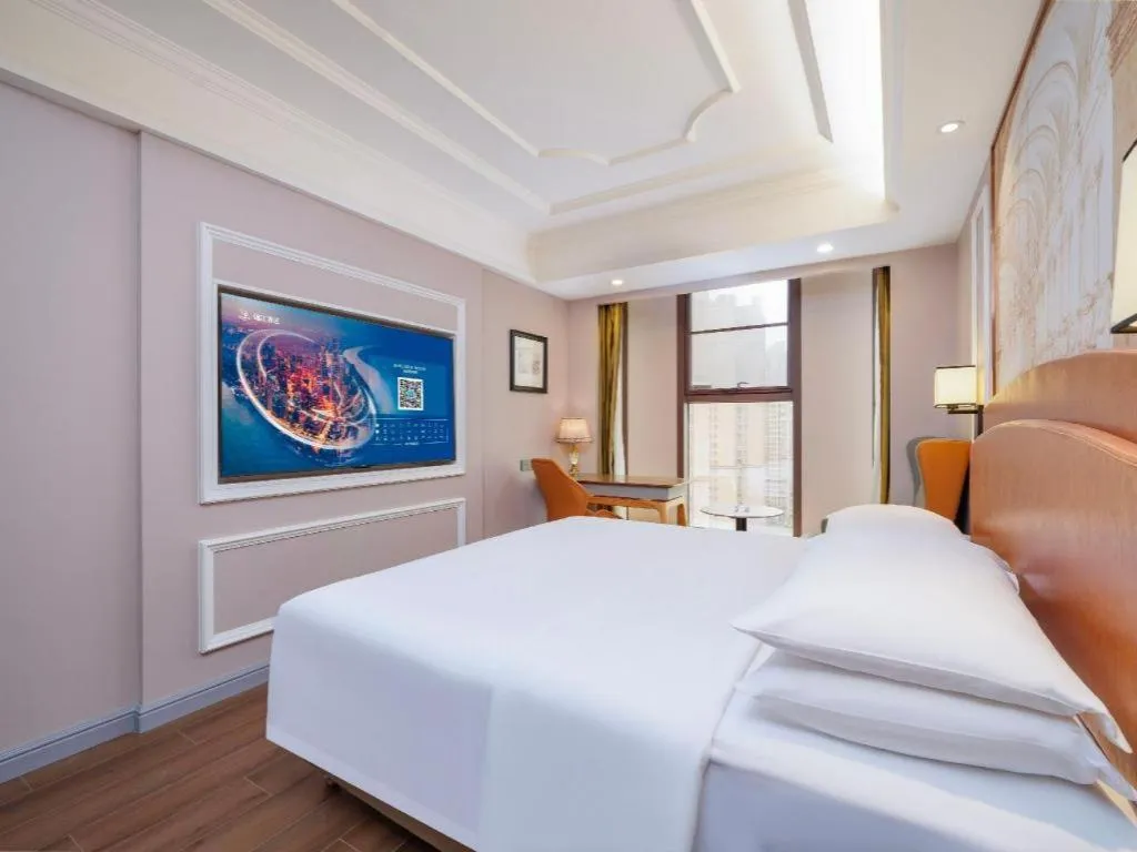 Bed in Vienna International Hotel Kunming Guangfu Road Aegean Shopping Center