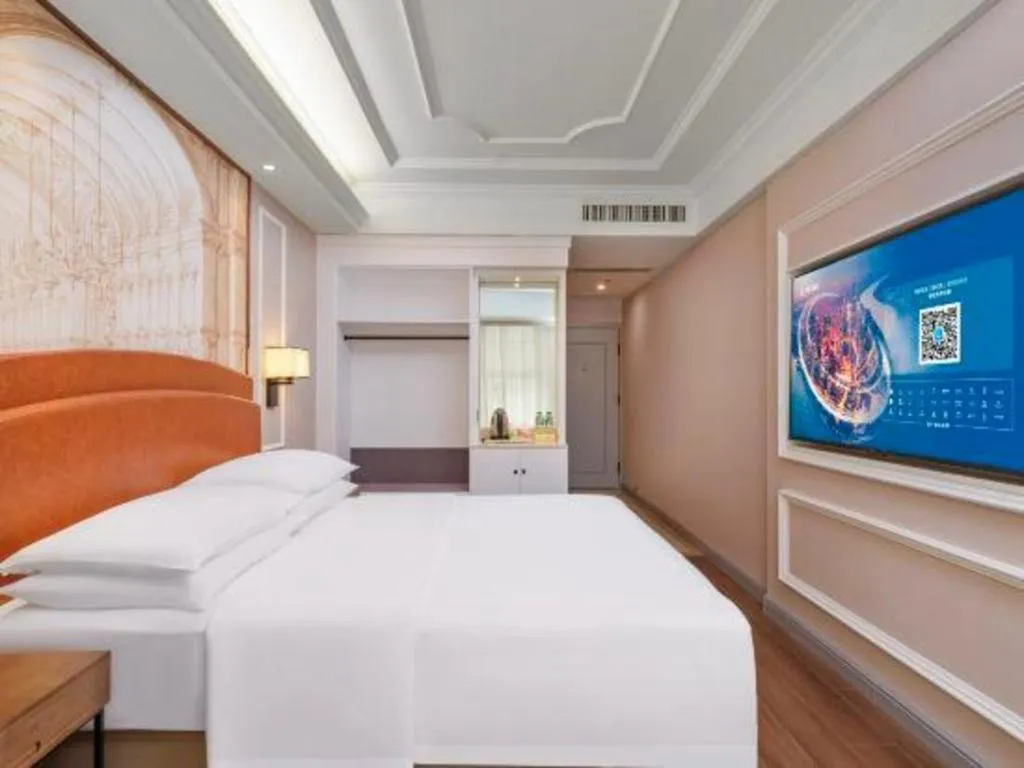 Bed in Vienna International Hotel Kunming Guangfu Road Aegean Shopping Center