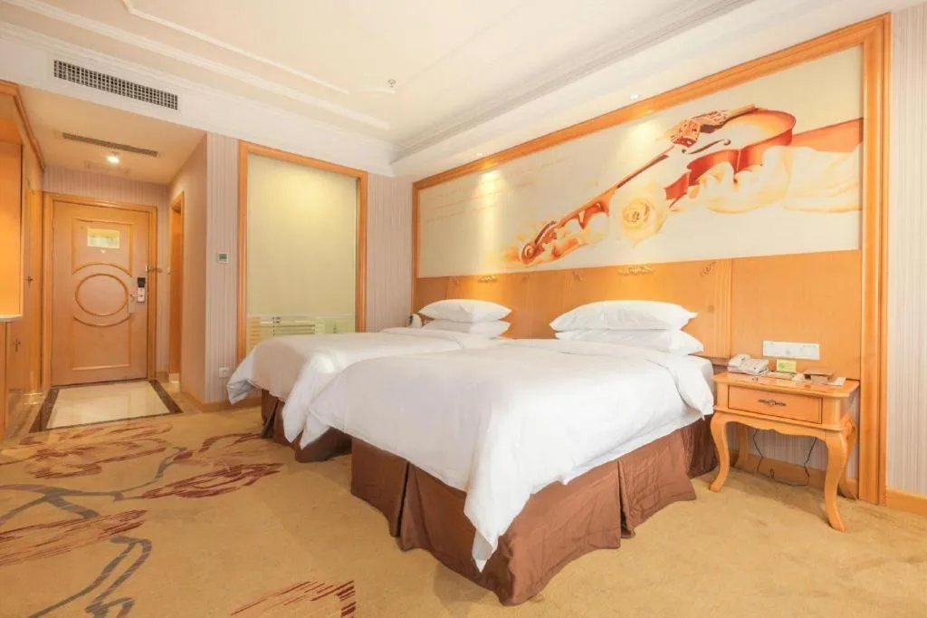 Bed in Vienna International Hotel Kunming Guangfu Road Aegean Shopping Center