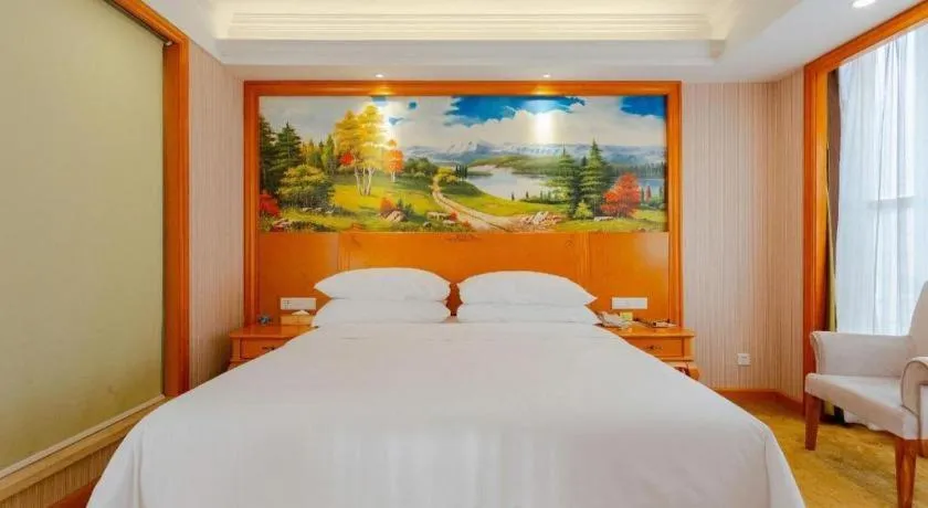 Bed in Vienna International Hotel Kunming Guangfu Road Aegean Shopping Center