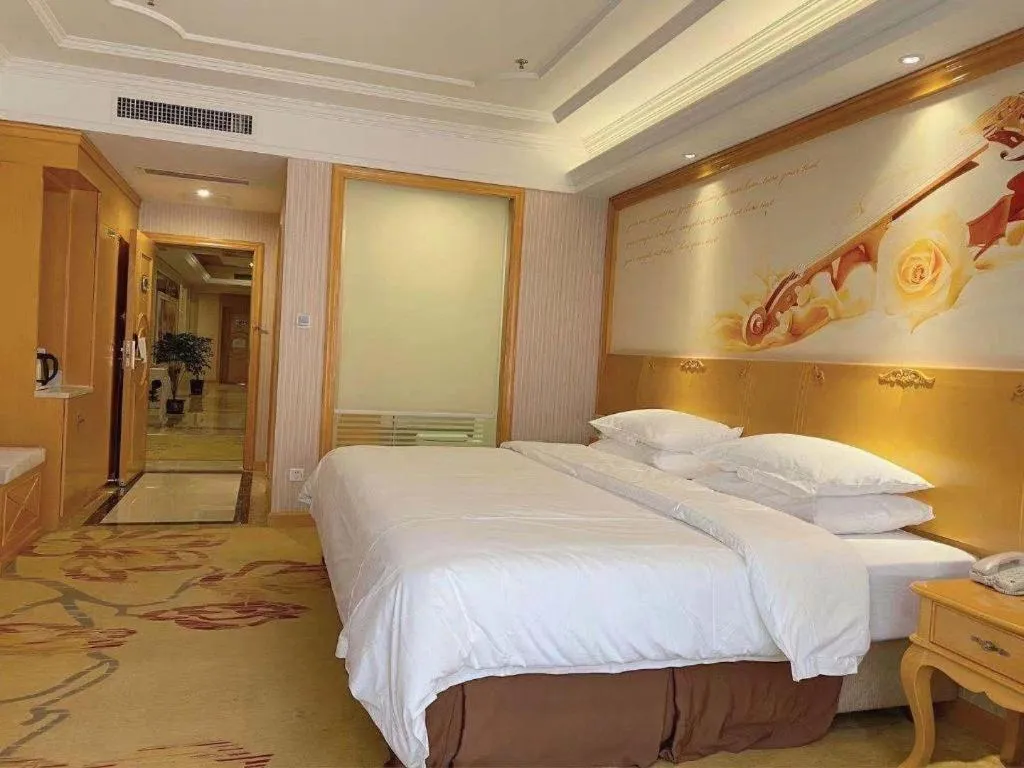 Bed in Vienna International Hotel Kunming Guangfu Road Aegean Shopping Center
