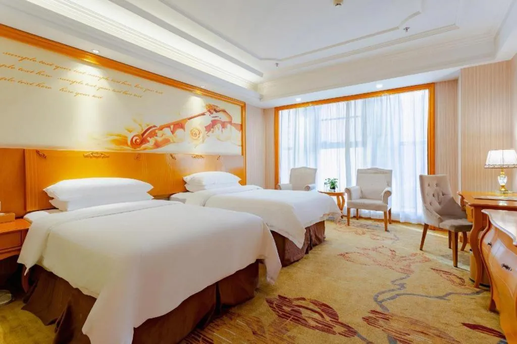 Bed in Vienna International Hotel Kunming Guangfu Road Aegean Shopping Center