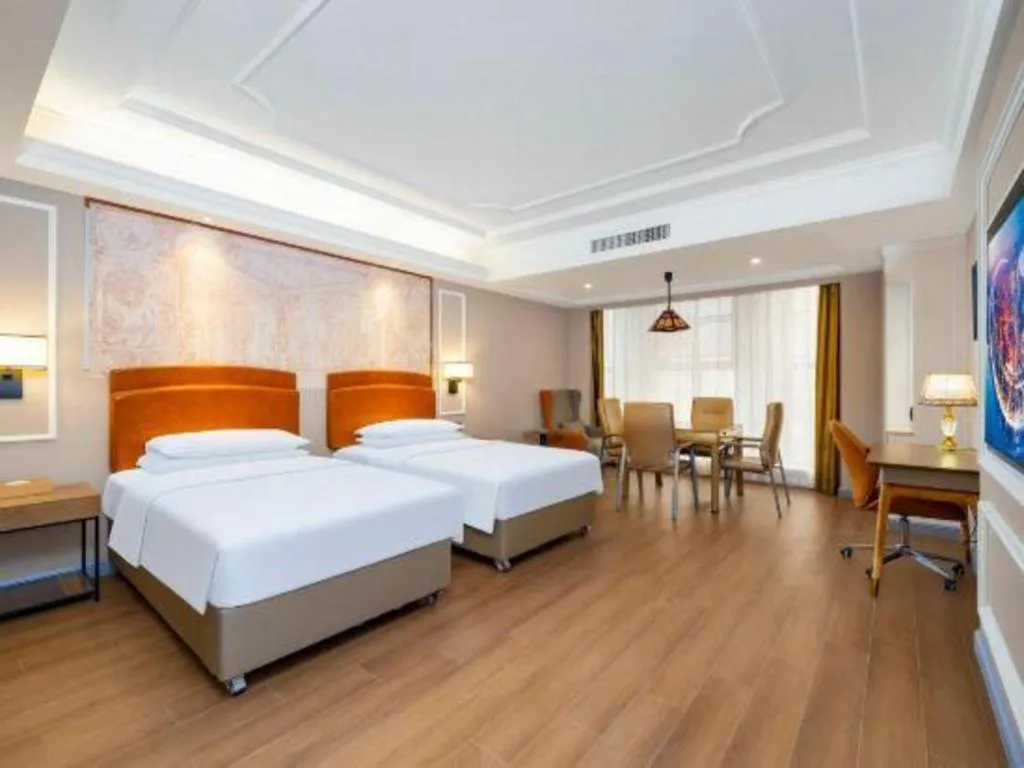 Bed in Vienna International Hotel Kunming Guangfu Road Aegean Shopping Center