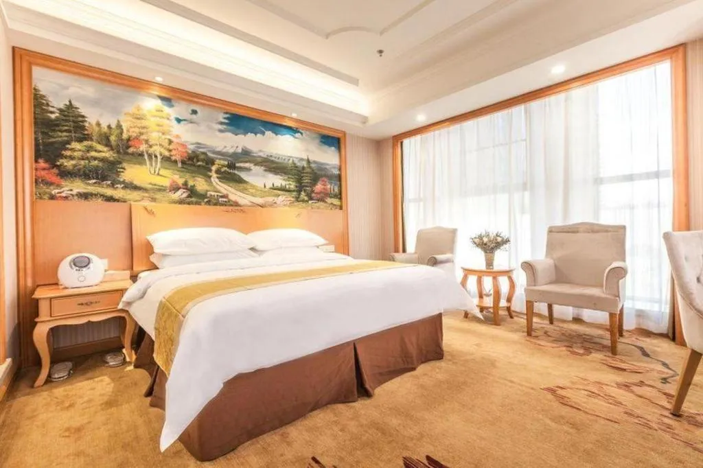 Bed in Vienna International Hotel Kunming Guangfu Road Aegean Shopping Center