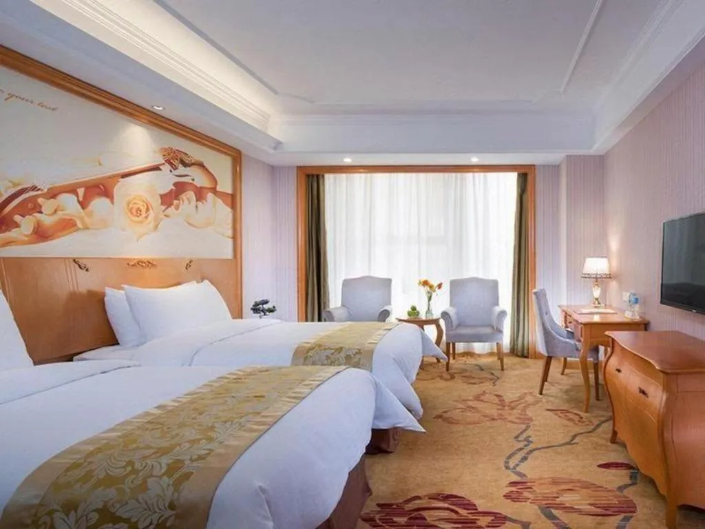 Bed in Vienna International Hotel Kunming Guangfu Road Aegean Shopping Center