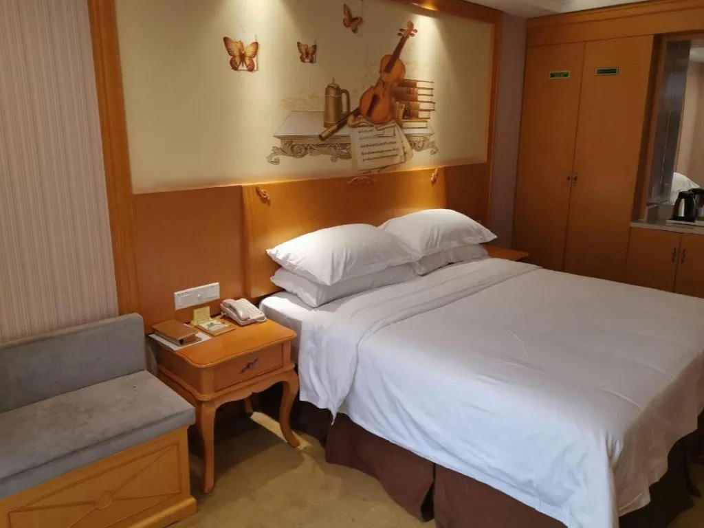 Bed in Vienna International Hotel Kunming Guangfu Road Aegean Shopping Center
