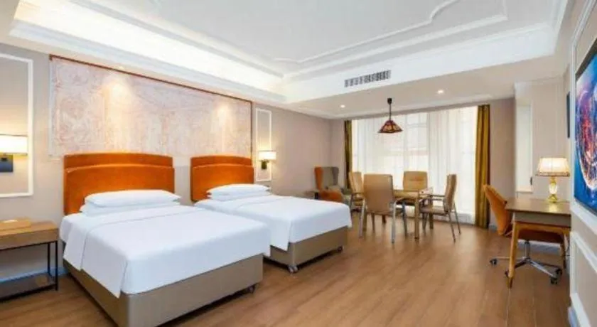 Bed in Vienna International Hotel Kunming Guangfu Road Aegean Shopping Center