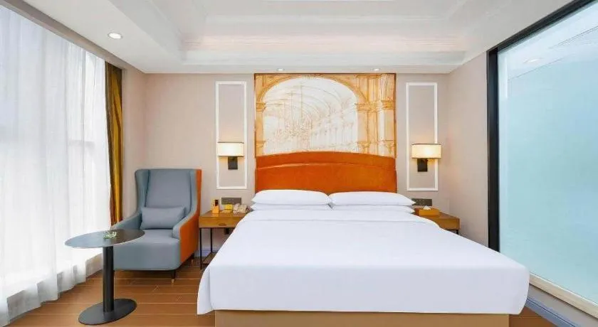 Bed in Vienna International Hotel Kunming Guangfu Road Aegean Shopping Center
