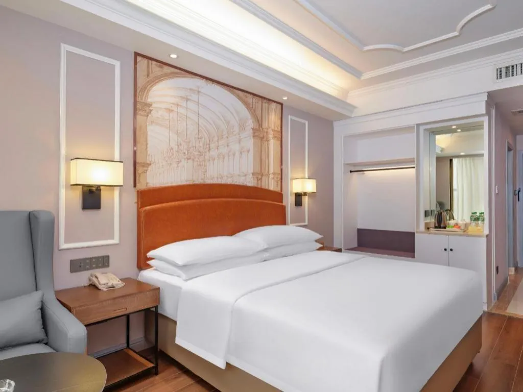 Bed in Vienna International Hotel Kunming Guangfu Road Aegean Shopping Center