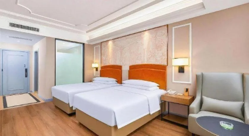 Bed in Vienna International Hotel Kunming Guangfu Road Aegean Shopping Center