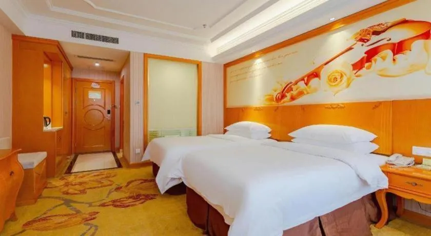 Bed in Vienna International Hotel Kunming Guangfu Road Aegean Shopping Center