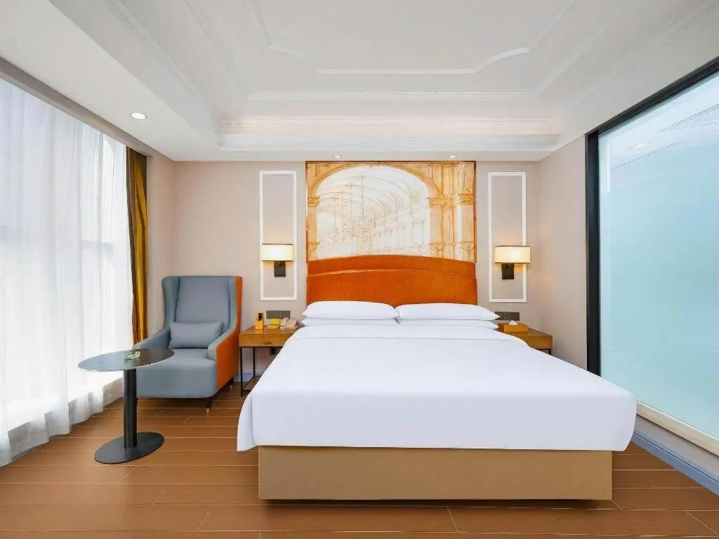 Bed in Vienna International Hotel Kunming Guangfu Road Aegean Shopping Center