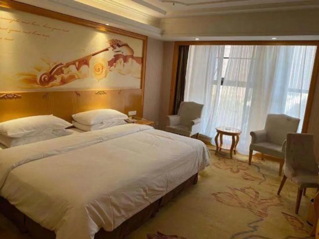 Bed in Vienna International Hotel Kunming Guangfu Road Aegean Shopping Center
