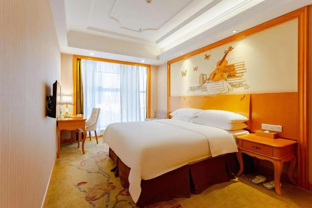 Bed in Vienna International Hotel Kunming Guangfu Road Aegean Shopping Center