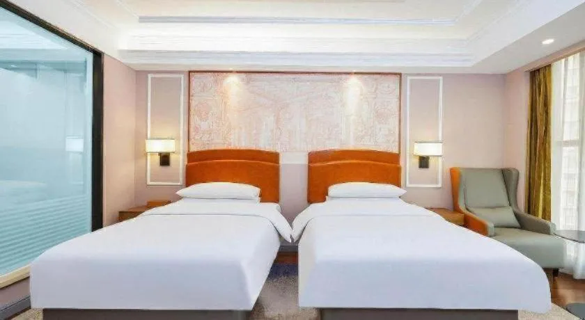 Bed in Vienna International Hotel Kunming Guangfu Road Aegean Shopping Center
