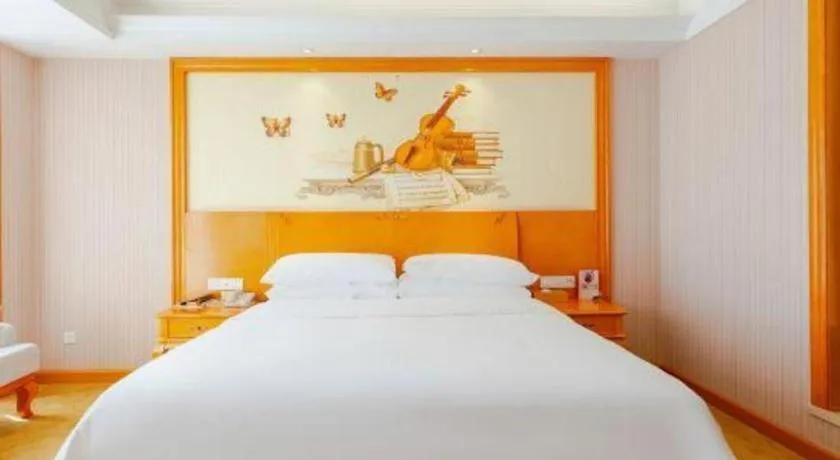 Bed in Vienna International Hotel Kunming Guangfu Road Aegean Shopping Center