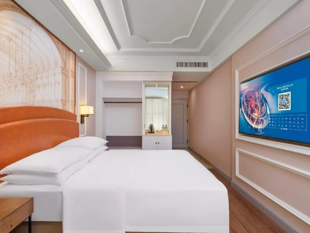 Bed in Vienna International Hotel Kunming Guangfu Road Aegean Shopping Center