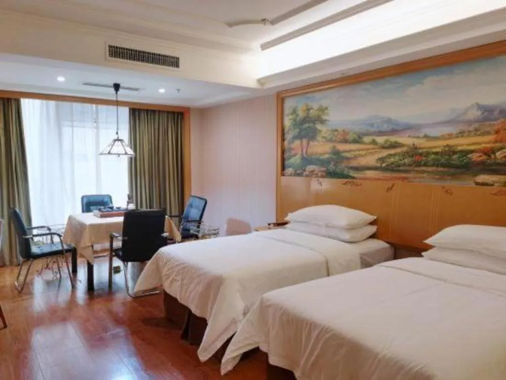 Bed in Vienna International Hotel Kunming Guangfu Road Aegean Shopping Center