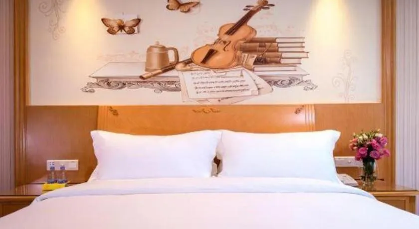 Bed in Vienna International Hotel Kunming Guangfu Road Aegean Shopping Center