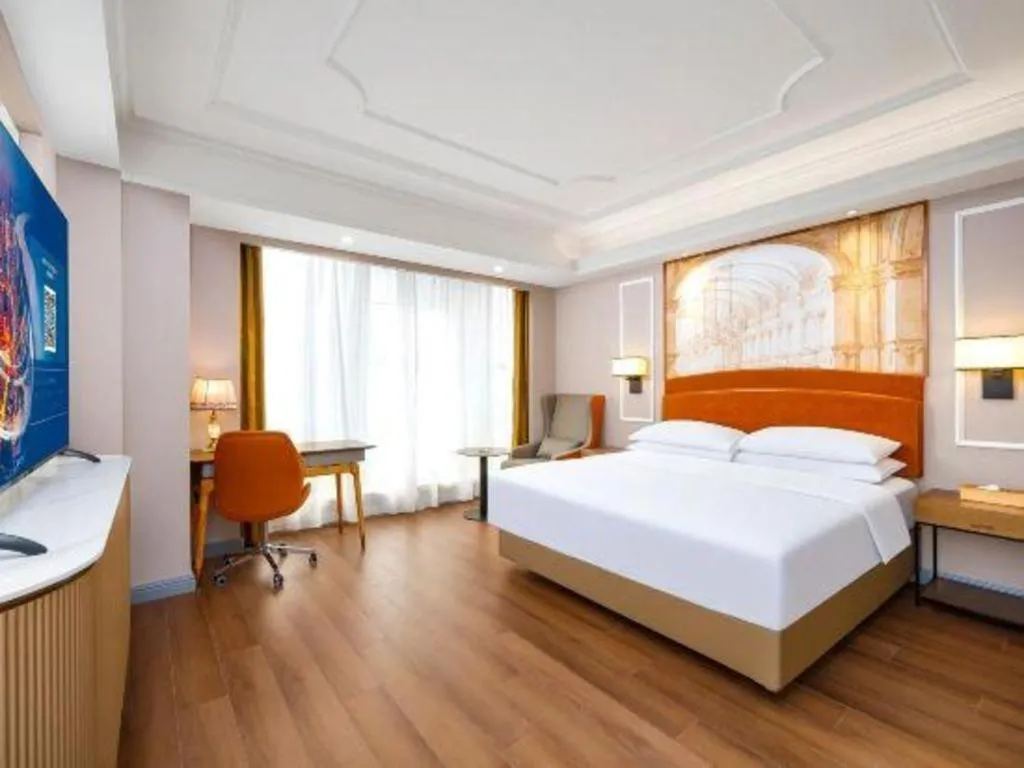 Bed in Vienna International Hotel Kunming Guangfu Road Aegean Shopping Center