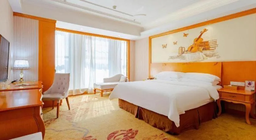 Bed in Vienna International Hotel Kunming Guangfu Road Aegean Shopping Center