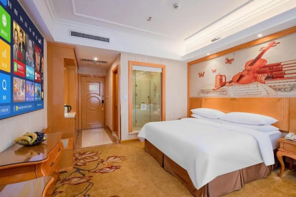 Bed in Vienna Hotel Guangzhou Airport Gaosu Pingsha