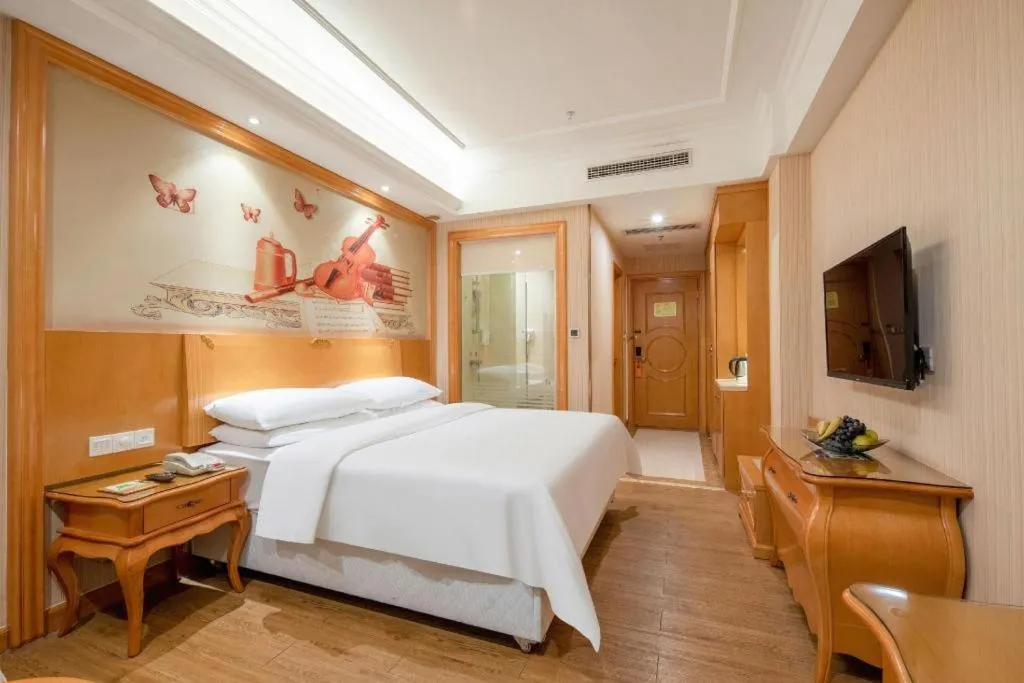 Bed in Vienna Hotel Guangzhou Airport Gaosu Pingsha