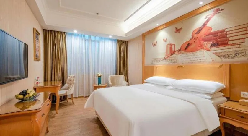 Bed in Vienna Hotel Guangzhou Airport Gaosu Pingsha