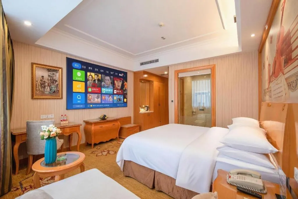Bed in Vienna Hotel Guangzhou Airport Gaosu Pingsha