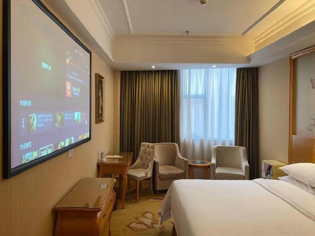 Bed in Vienna Hotel Guangzhou Airport Gaosu Pingsha